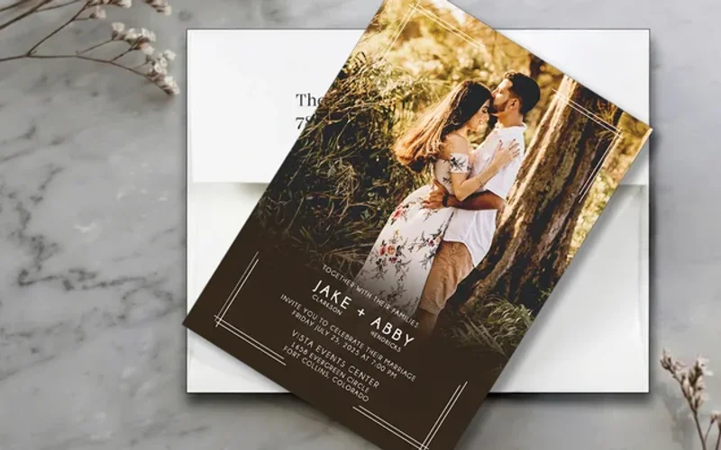 Photo wedding invitation featuring an engagement portrait with elegant text overlay and design elements